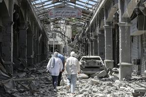 People make their way through the heavily damaged historic market of Nabatieh as residents displaced by the fighting return to southern Lebanon on June 15, 2026. Israel's defence minister said on June 15, that Israeli forces would remain in Lebanon, Syria and Gaza indefinitely, hours after the United States and Iran agreed to end the Middle East war, including in Lebanon. 