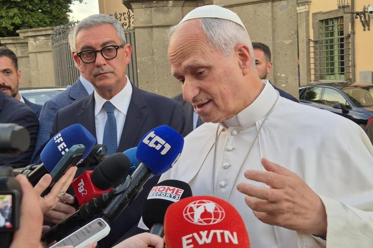 Pope Leo XIV talks to reporters outside the papal villa of Castel Gandolfo on June 16, 2026, before returning to Rome after a daylong stay there.