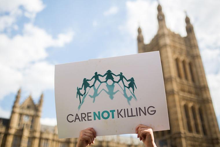 Campaigners against assisted dying gather outside the Houses of Parliament ahead of a House of Commons vote that rejected the legislation on Sept. 11, 2015, in London. 