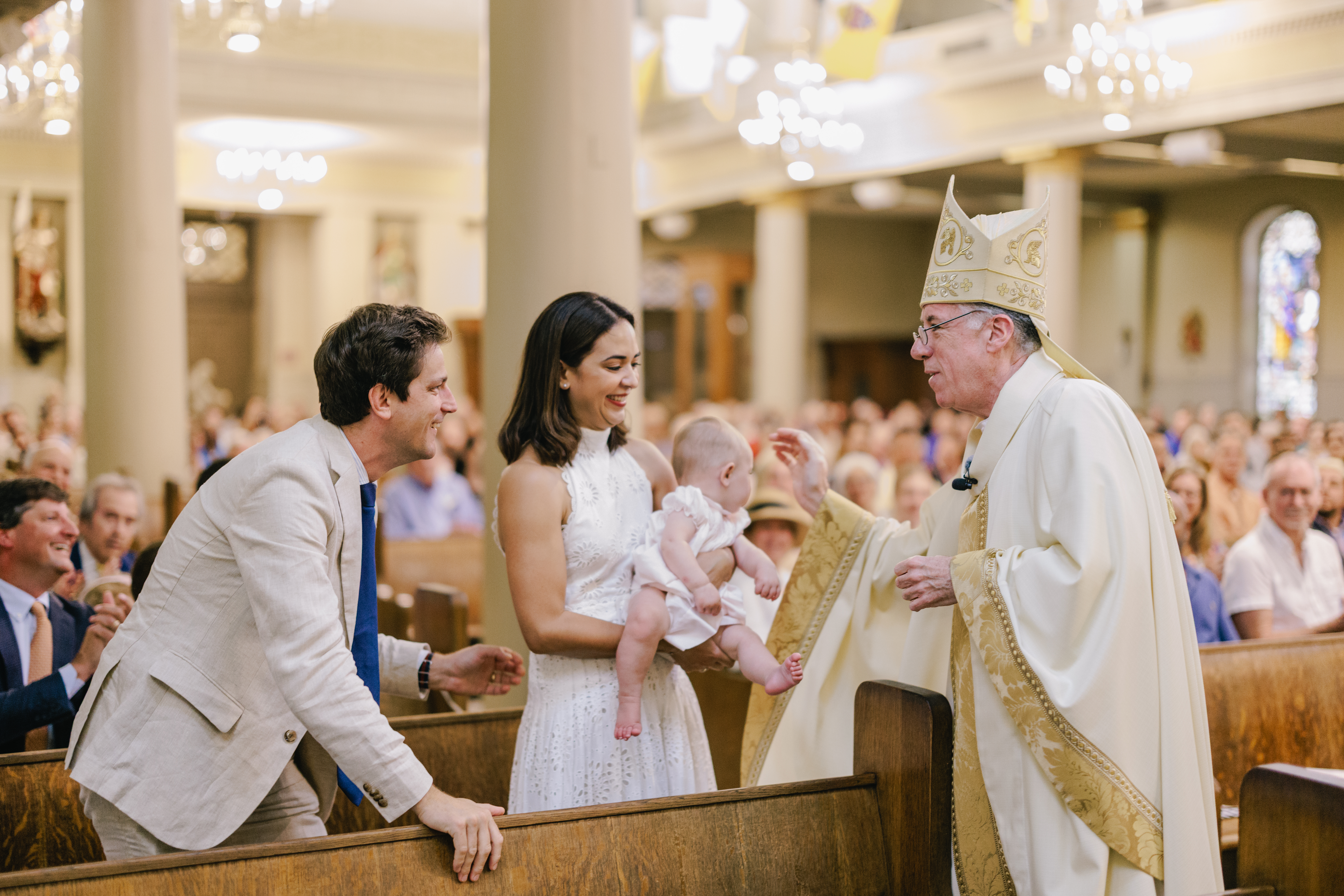 Archbishop James Checchio greets a family attending the Consecration to the Sacred Heart at St. Louis Cathedral in New Orleans, La., on June 14, 2026.