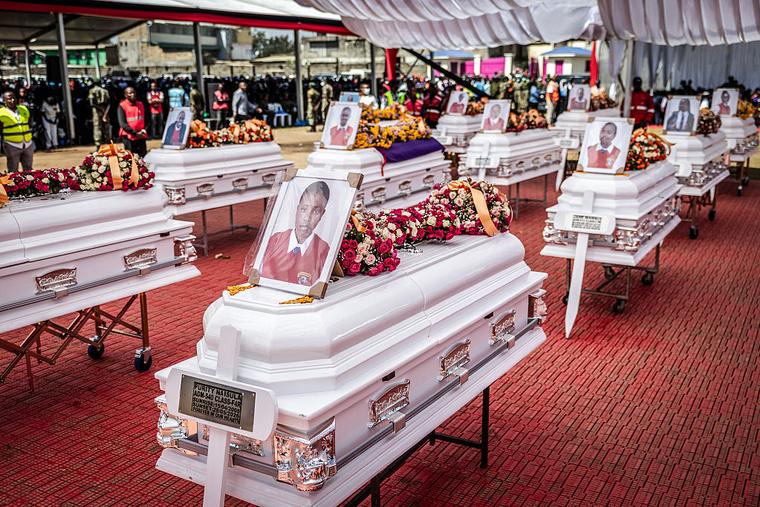 Mourners pray near coffins of victims of the Utumishi Girls’ Academy Senior School fire during a Mass in Gilgil on June 12, 2026, after a spate of school fires across Kenya.