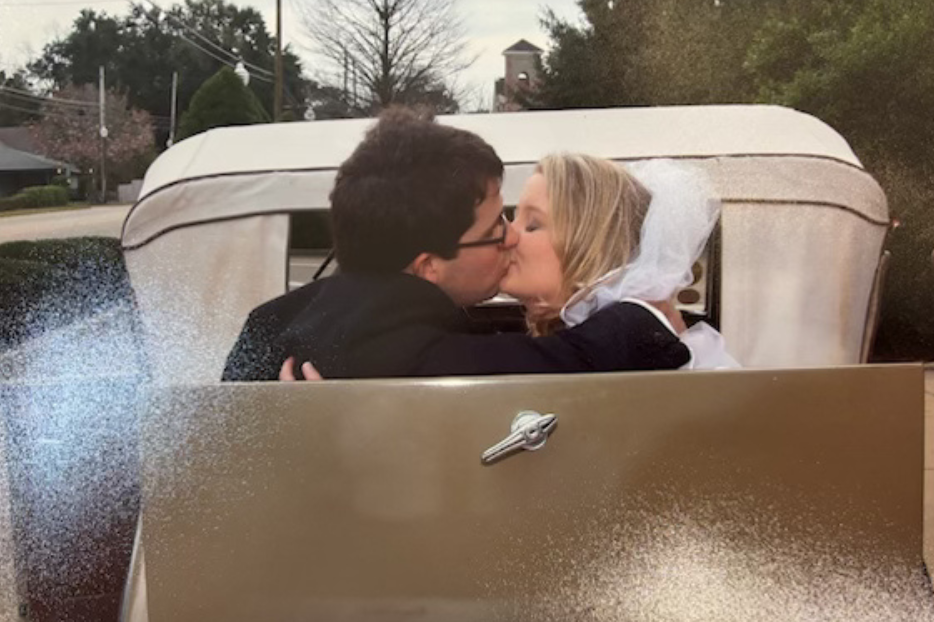 Driving off together, husband and wife, after celebrating the sacrament of matrimony.