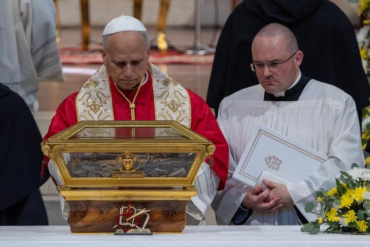 Pope Leo XIV venerates relics of St. Augustine at the Basilica of Saint Peter in Ciel d'Oro, in Pavia, Italy, on June 20, 2026. 