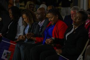 People pray during a candlelight vigil for Haitians living in the U.S. under the Temporary Protected Status (TPS) immigration program in Miami on Feb. 3, 2026. TPS status offers work authorization and protection from deportation. 