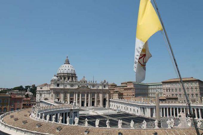 A view of St. Peter's Basilica and Vatican flag.