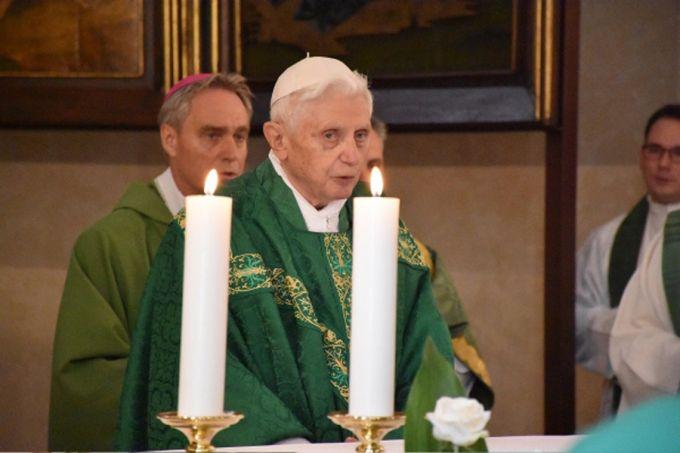 Pope Emeritus Benedict XVI celebrates Mass in the chapel of the Vatican's Teutonic Cemetery for his former students during their annual gathering on Aug. 30, 2015. 