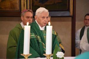 Pope Emeritus Benedict XVI celebrates Mass in the chapel of the Vatican's Teutonic Cemetery for his former students during their annual gathering on Aug. 30, 2015. 