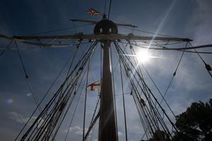 The sun shines down upon a ship's mast during the National Eucharistic Pilgrimage June 2026.