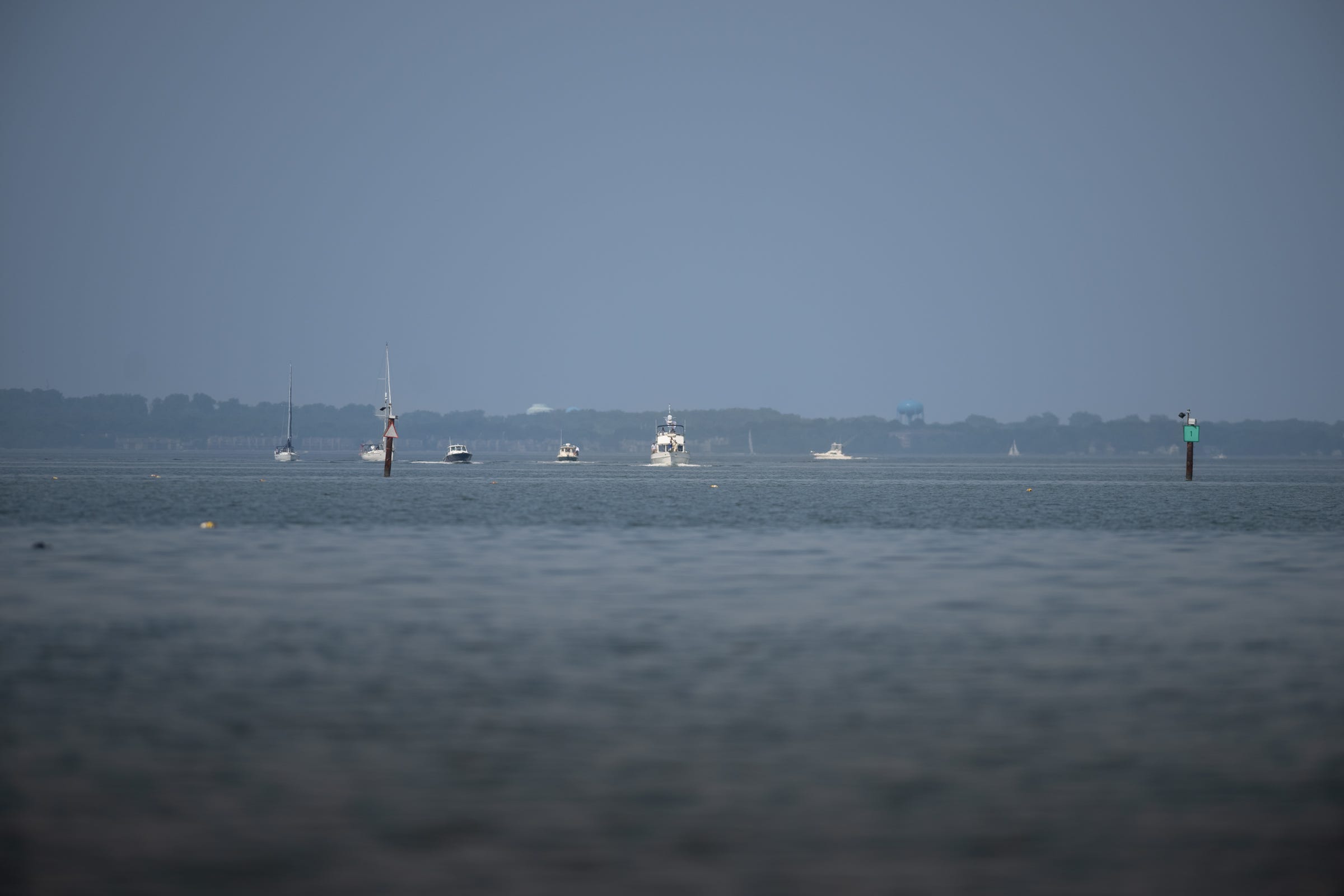 Boats sit on the bay. 
