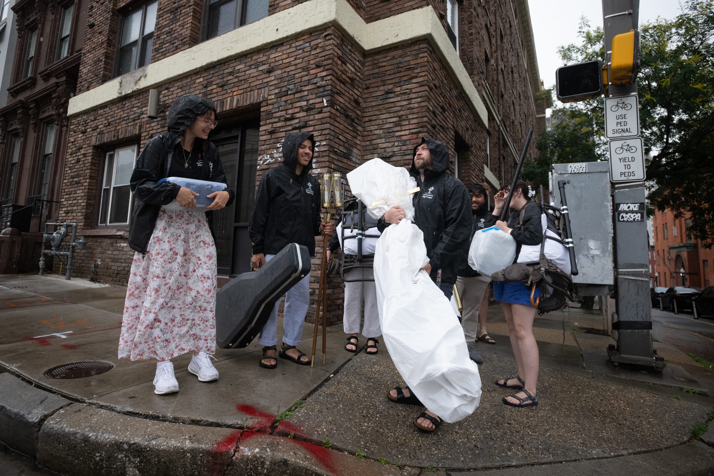 BALTIMORE- The Perpetual Pilgrims carried instruments, vestments, candles, and exhaustion through the rain. Pilgrimage is not an idea. It’s surrender.