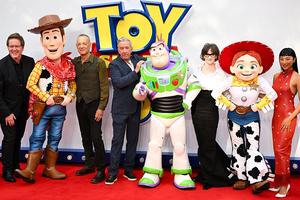 (L-R) Andrew Stanton, Woody, Tom Hanks, Tim Allen, Buzz Lightyear, Joan Cusack, Jessie and Greta Lee attend the ‘Toy Story 5’ U.K. launch event at Odeon Luxe Leicester Square on May 28, 2026 in London.
