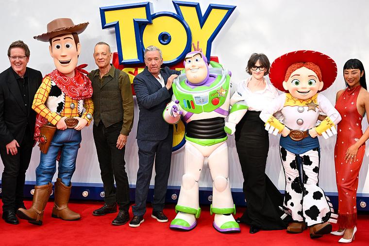 (L-R) Andrew Stanton, Woody, Tom Hanks, Tim Allen, Buzz Lightyear, Joan Cusack, Jessie and Greta Lee attend the ‘Toy Story 5’ U.K. launch event at Odeon Luxe Leicester Square on May 28, 2026 in London.