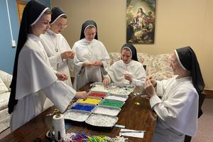 The Dominican Sisters of Mary, Mother of the Eucharist, make the special rosaries at their convent in Peoria, Illinois: left to right, Sisters Marie Jeannette, Maria Miguel, Jude Andrew, Peter Grace and Maria Kolbe.