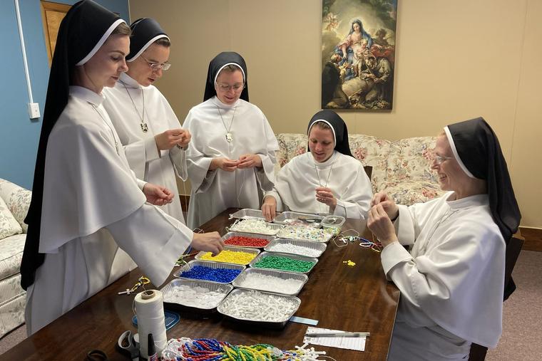 The Dominican Sisters of Mary, Mother of the Eucharist, make the special rosaries at their convent in Peoria, Illinois: left to right, Sisters Marie Jeannette, Maria Miguel, Jude Andrew, Peter Grace and Maria Kolbe.