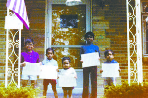 Future Bishop Earl Fernandes (right), age 3, stands with his siblings on the front porch of the family’s home during the U.S. bicentennial celebration on Independence Day, July 4, 1976.