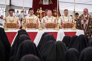 The new illicitly ordained Catholic bishops — French Marc Hanappier, French Michel Poinsinet de Sivry, American Michael Goldade and Swiss Pascal Schreiber — stand next to Swiss traditionalist Catholic Bishop of the Society of Saint Pius X Bernard Fellay during a schismatic consecration in Econe, western Switzerland, on July 1, 2026.