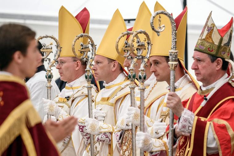 Newly ordained SSPX Bishops (left to right) Pascal Schreiber, Michael Goldade, Michel Poinsinet de Sivry and Marc Hanappier stand with Bishop Alfonso de Galarreta after their episcopal ordination in Écône, Switzerland, on Wednesday.