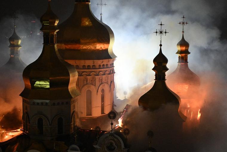 Smoke and fire rises from Dormition Cathedral in the Orthodox complex of the Kyiv Pechersk Lavra following a Russian missile strike on the Ukrainian capital on June 15, 2026, amid the Russian invasion in Ukraine. 