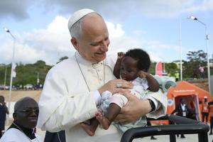 Pope Leo XIV greets a baby during his visit to the Marian shrine of Mama Muxima in Kimbaxe, Angola, on April 19, 2026.