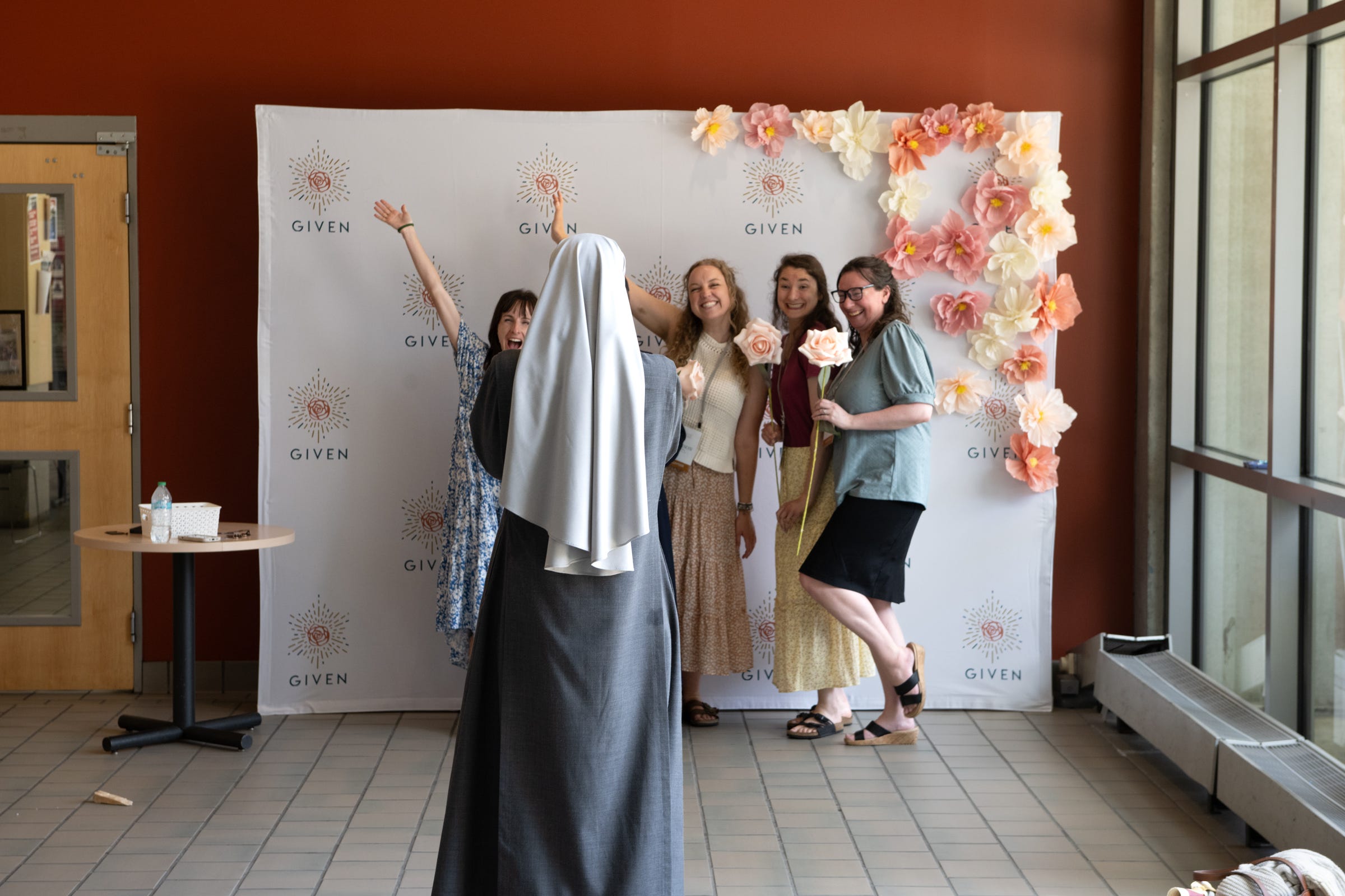 Attendees take fun photos during the GIVEN conference.