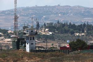 This picture taken from a position in the Upper Galilee in northern Israel shows a base of United Nations in southern Lebanon near the Israel-Lebanon border on July 1, 2026. Israel’s defense minister said on July 1 that Israeli forces would remain in self-proclaimed “security zones” established in Lebanon, Syria, and Gaza, without any timeline for withdrawal. 