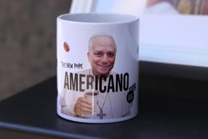A portrait of Pope Leo XIV adorns a coffee cup with the word ‘Americano,’ which refers both to Pope Leo XIV’s nationality and a popular Italian coffee type, outside a coffee shop in Rome on May 17, 2025. 