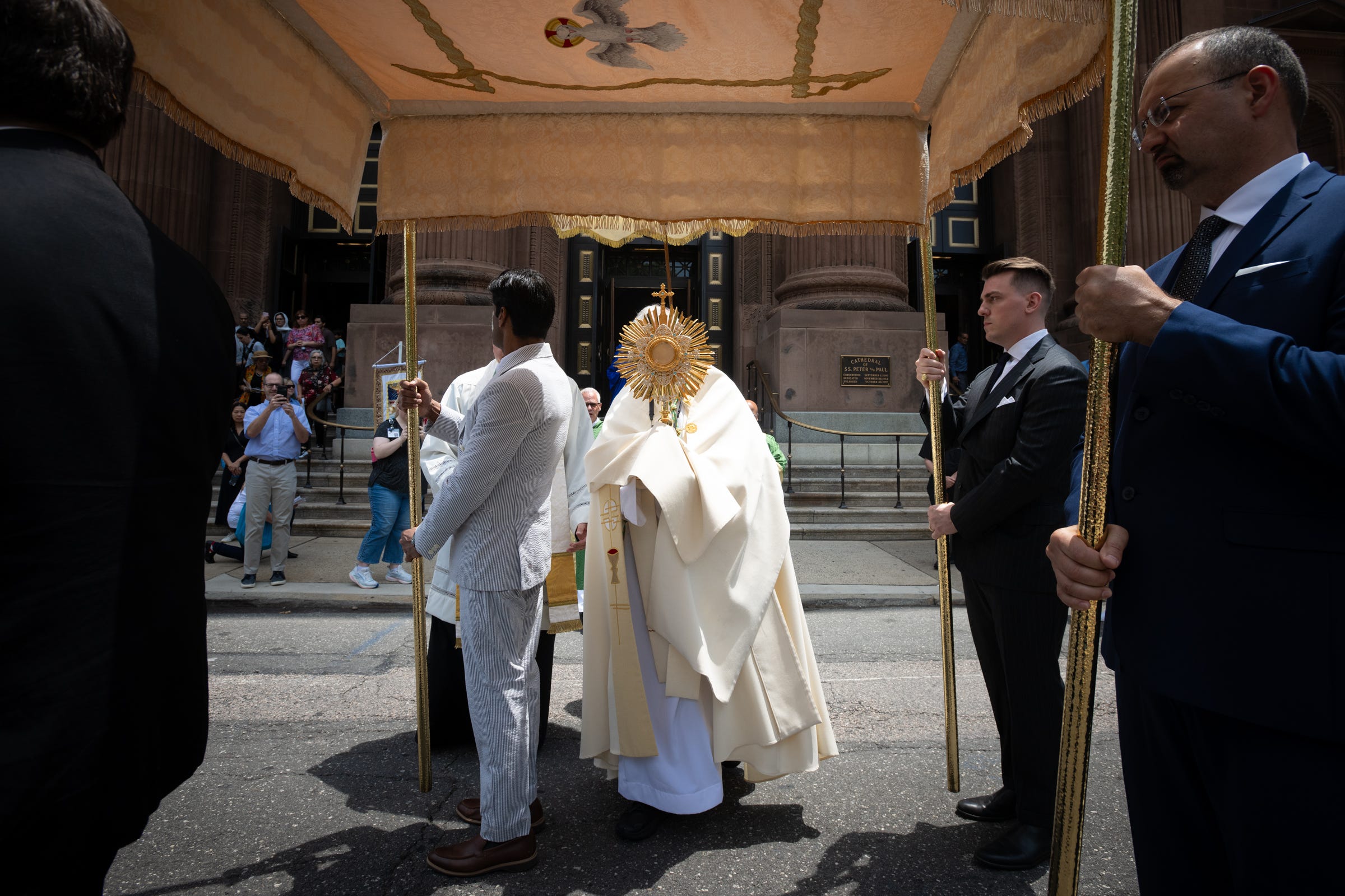 Archbishop Nelson Perez carries the monstrance leading the Eucharistic Pilgrimage.