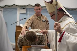 Archbishop Timothy P. Broglio, Archbishop of the Archdiocese for the U.S. Military Services, performs a baptism in the chapel at Camp Lemonnier, Djibouti, Dec. 19, 2025. 