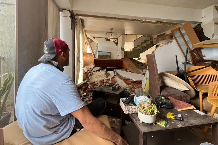 Kamar Galíndez in his destroyed apartment in the Playa Grande neighborhood in La Guaira, Venezuela.