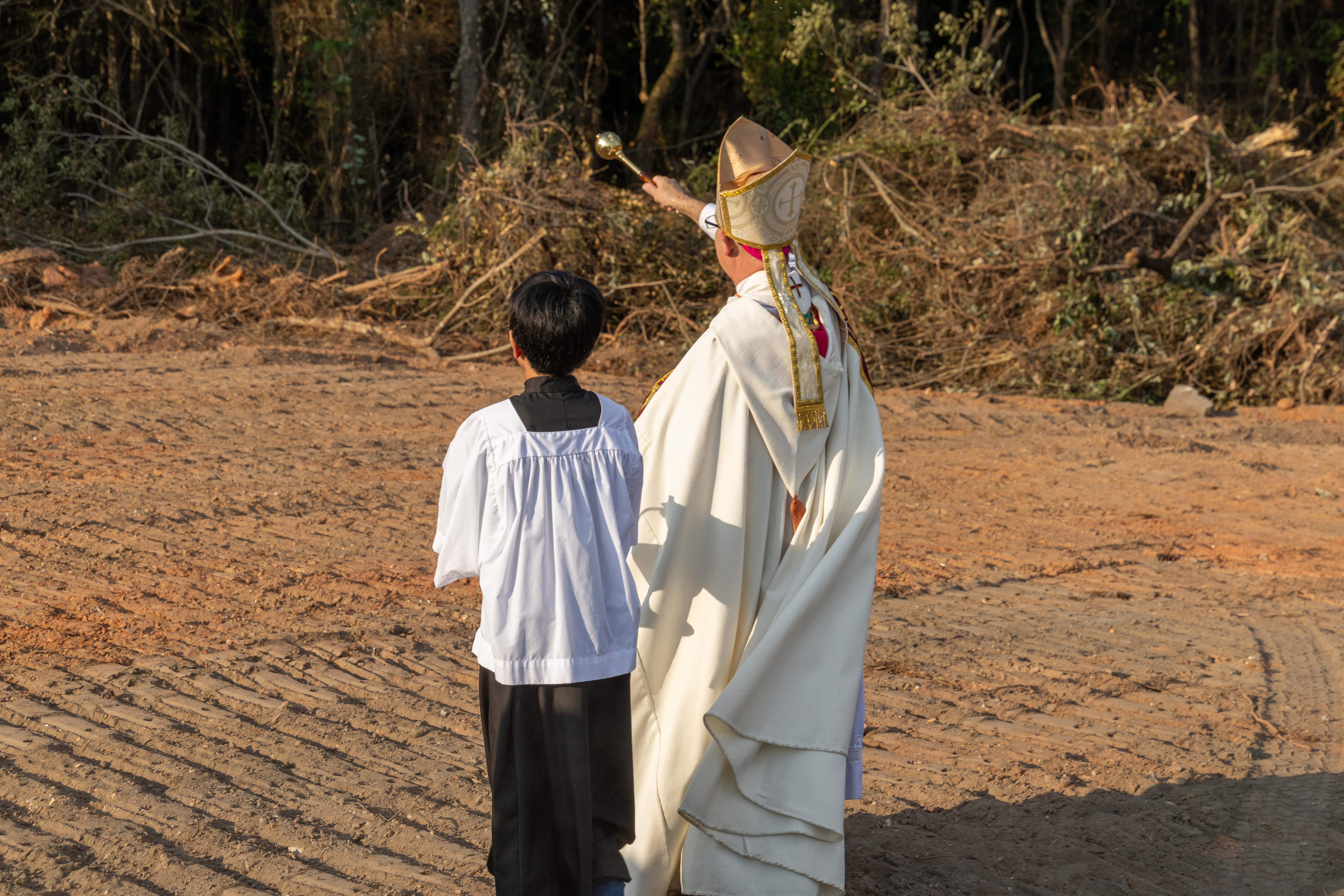 Construction site being blessed before building begins in the Archdiocese of Mobile, Alabama.