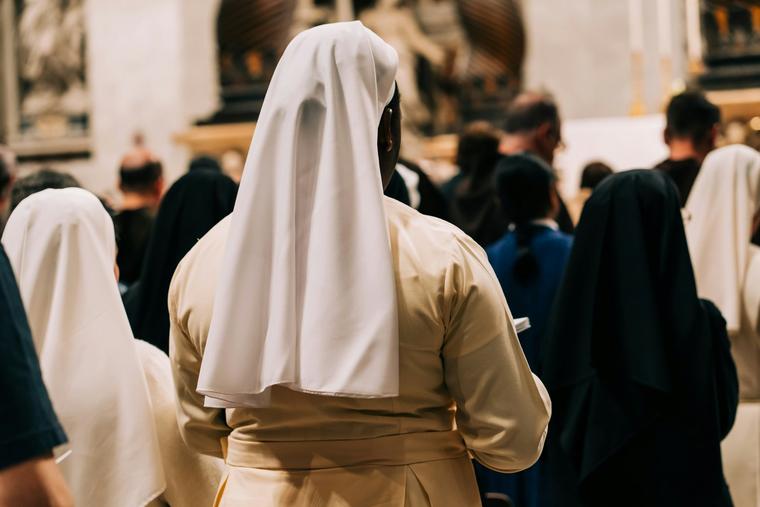 Religious sisters pray in St. Peter’s Basilica at the Vatican.