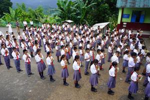 Students pray during morning assembly at a Catholic school in Borduria in Arunachal Pradesh, northeastern India, in July 2025. 