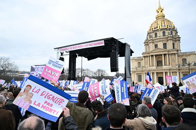 A demonstrator holds a placard reading “Dignity not death!” during the “Marche pour la Vie” (“March for Life”) to protest against France’s bill for the creation of a right to assisted dying, at the Place Vauban in Paris on Jan. 18, 2026. A major societal reform of the French president’s second five-year term, a bill on assisted dying has been debated multiple times and the National Assembly gave final approval on July 15, making France one of the few European countries to legalize the practice. 