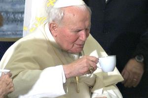 Pope St. John Paul II drinks a cup of coffee in Jerusalem on March 23, 2000.