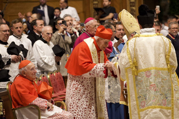 Albanian Cardinal Ernest Simoni (c) greets Cardinal Raymond Burke at a pontifical Mass in St. Peter’s Basilica on Oct. 25, 2025.