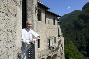 Pope Leo XIV stands at a window balcony at St. Benedict Abbey in Subiaco, Italy, on July 22, 2026.  