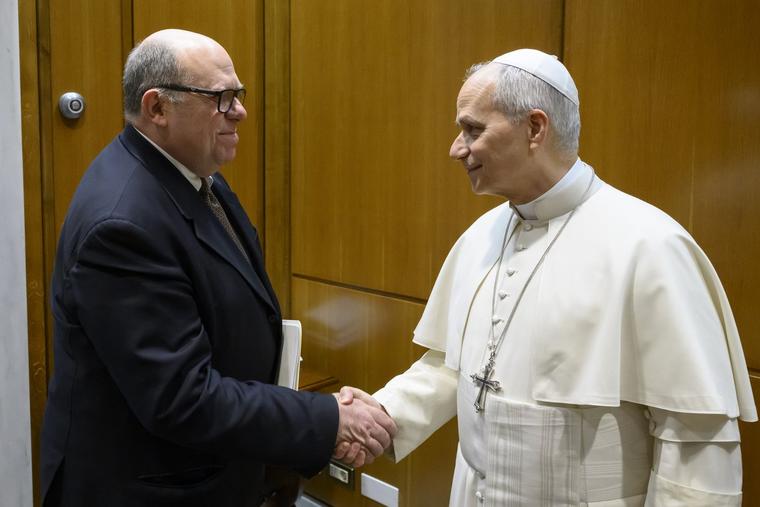 Journalist Alessandro Banfi greets Pope Leo XIV during a meeting on March 18, 2026.