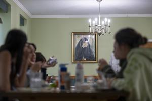 Young women gather for dinner at Centro Maria, a Catholic housing residence run by Religious of Mary Immaculate sisters in Washington.