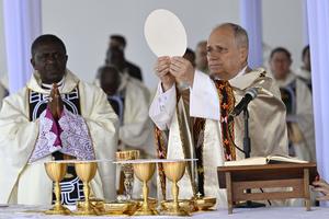 Pope Leo XIV elevates the Eucharist during the papal Mass at Bamenda Airport in Cameroon, Thursday, April 16, 2026. 
