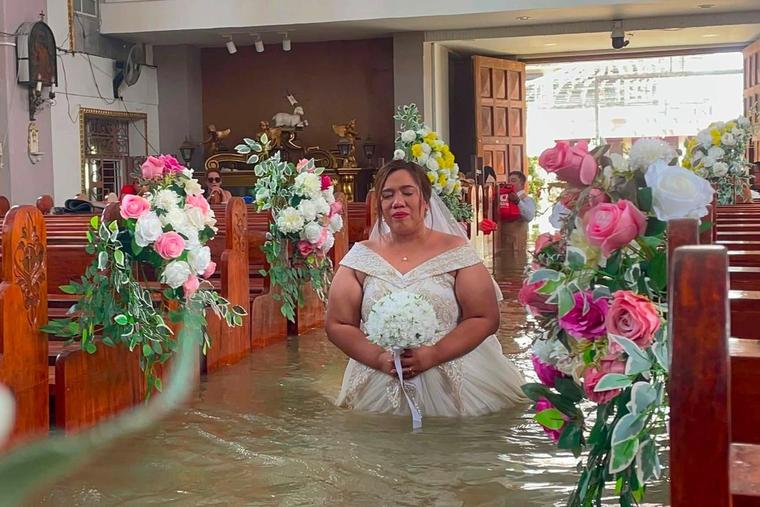 Catholic Couple Braves Cold Waters on Wedding Day Amid Monsoon