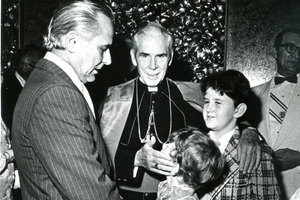 The Bunson family enjoys a visit with Archbishop Fulton Sheen. Young Matthew is looking up at the archbishop. 