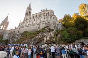 Pilgrims gather at the foot of the grotto in Lourdes where Our Lady appeared to St. Bernadette in 1858 on Sept. 25 as they wait for Pope Leo's visit as part of his three-day papal trip to France. 